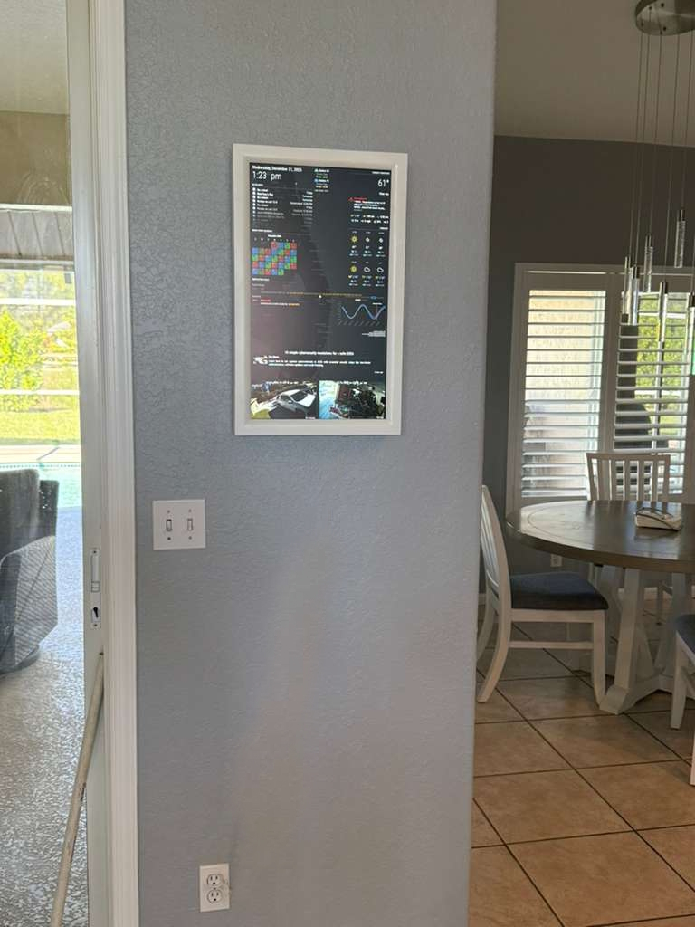 Customer install — display mounted on kitchen wall between rooms