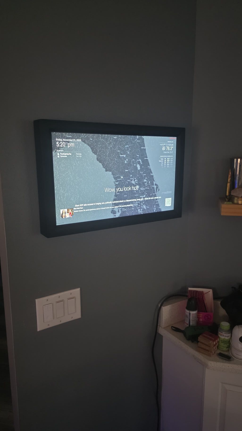 Customer install — landscape display wall-mounted with radar and welcome screen